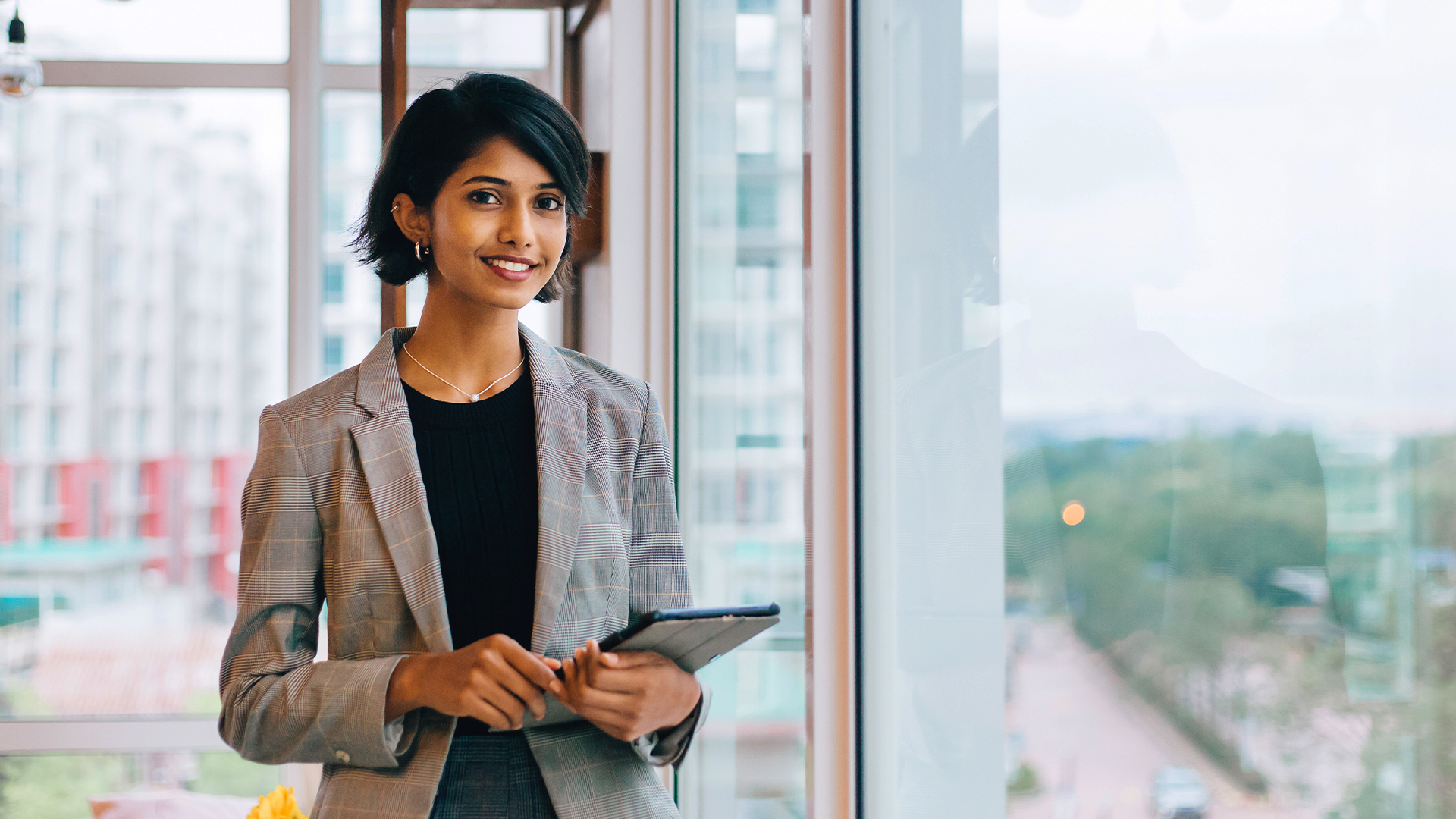 Financial professional female smiling in her office