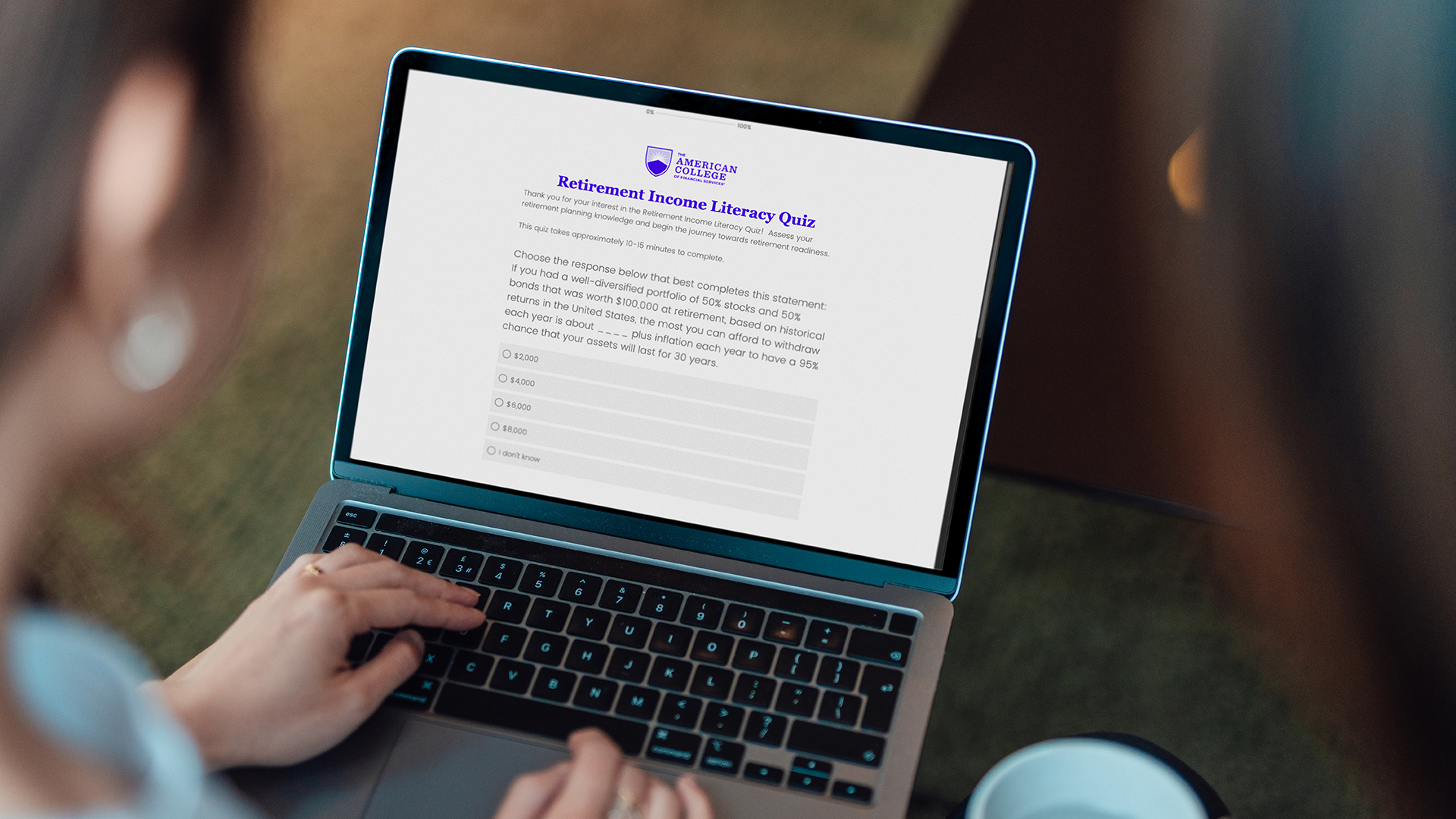 Woman looking at the Retirement Income Literacy Study on her laptop