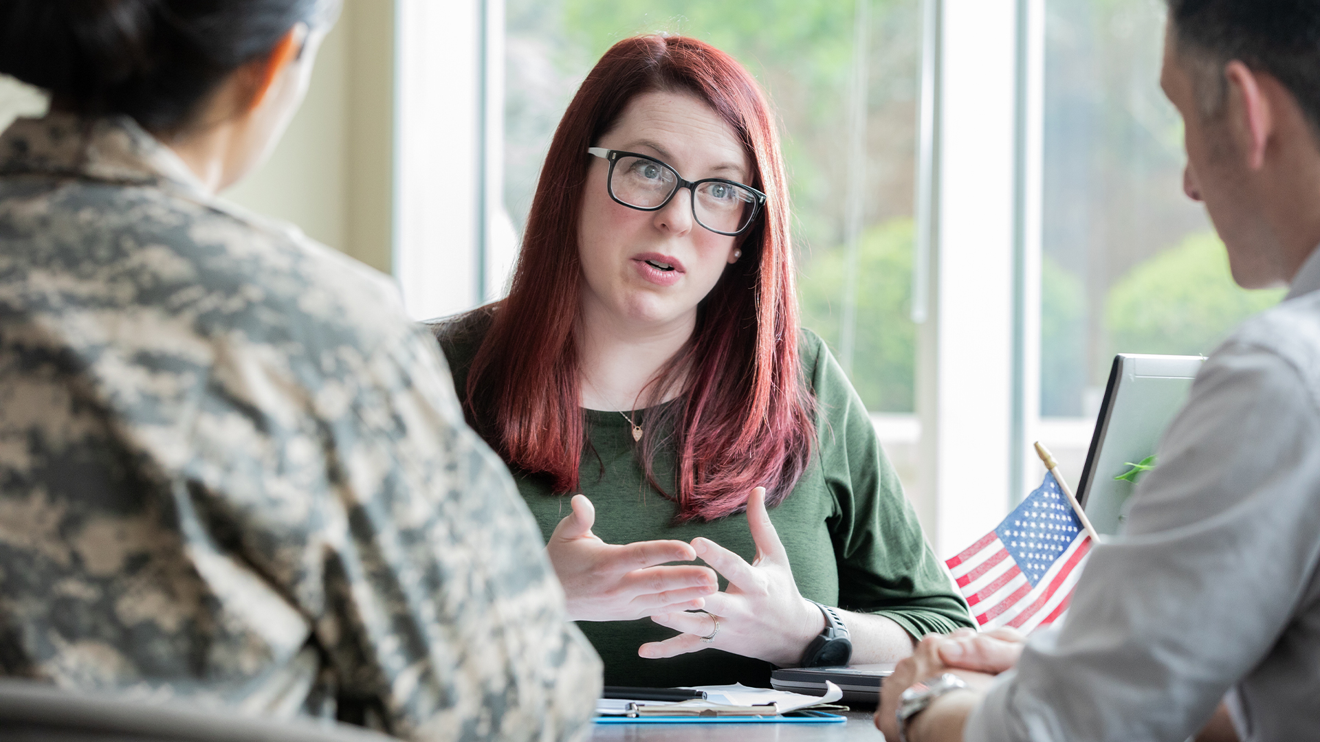 Female financial advisor speaking with a military client