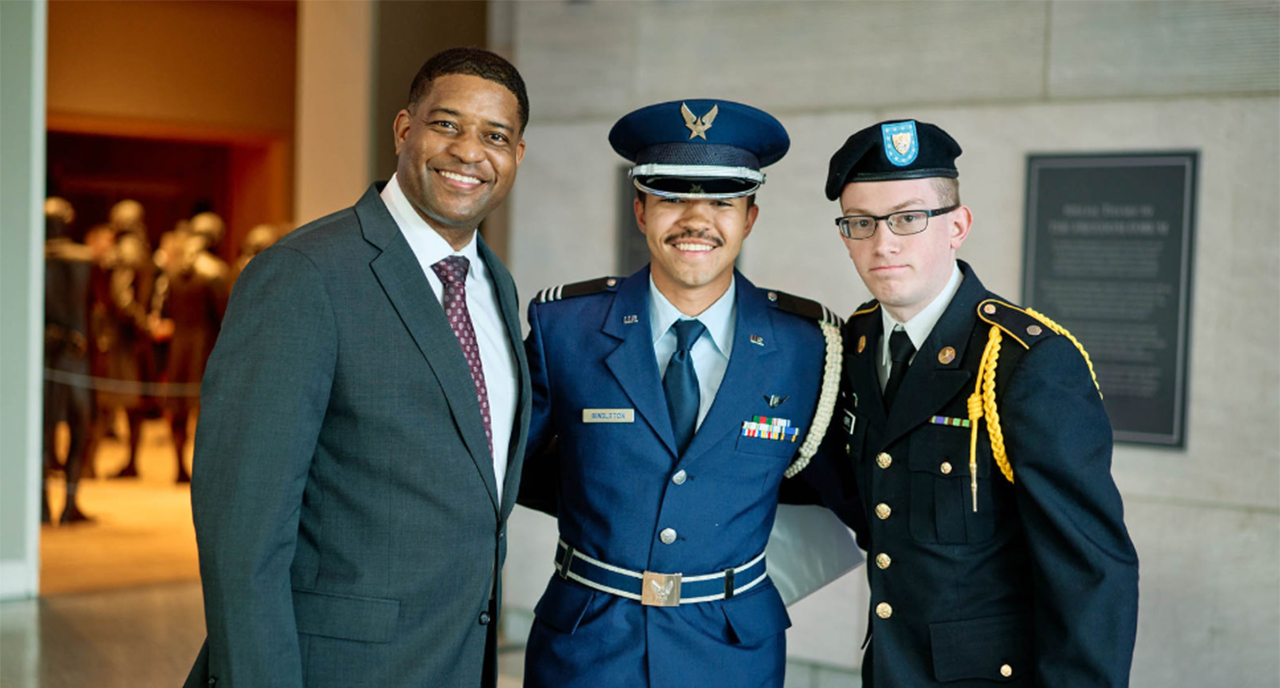 Phil Easton with two military servicemen