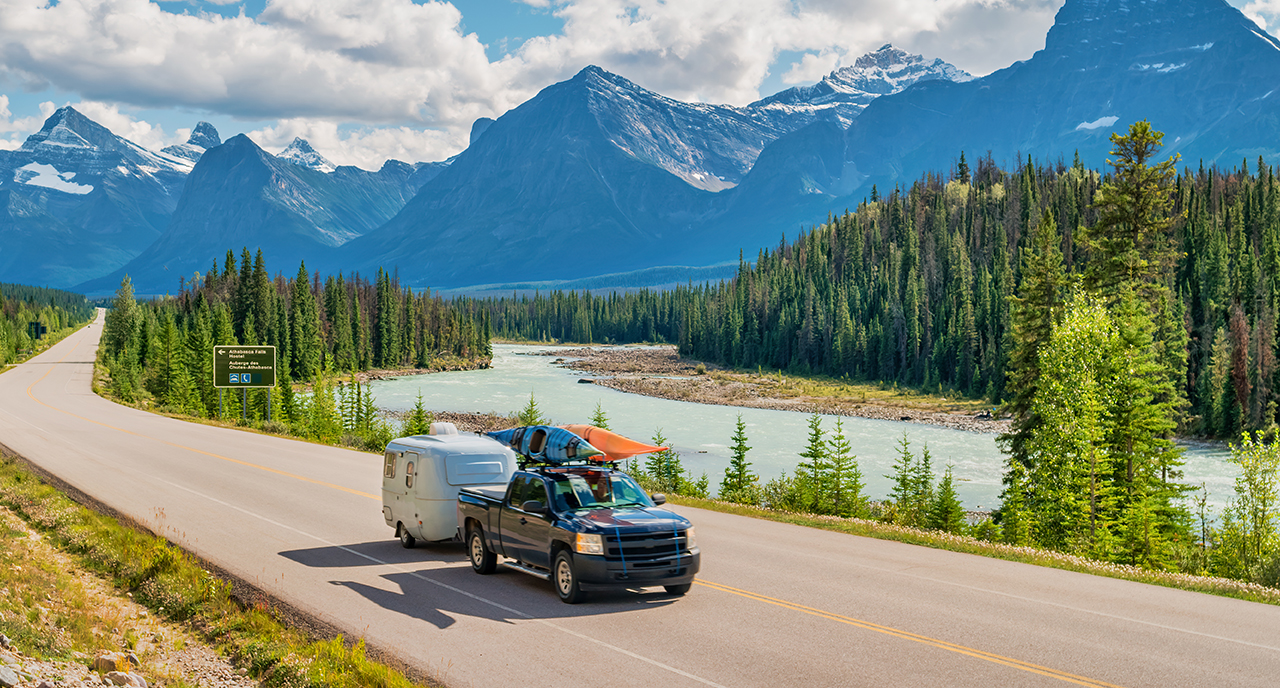 Truck driving through scenic road 