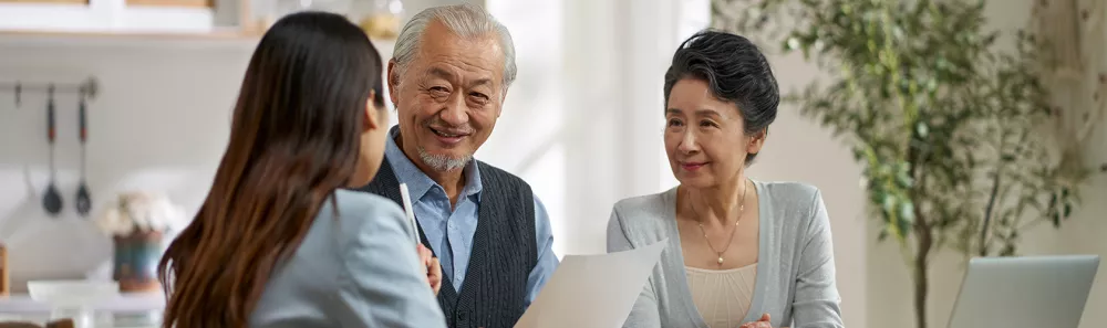 Retired couple talking to advisor