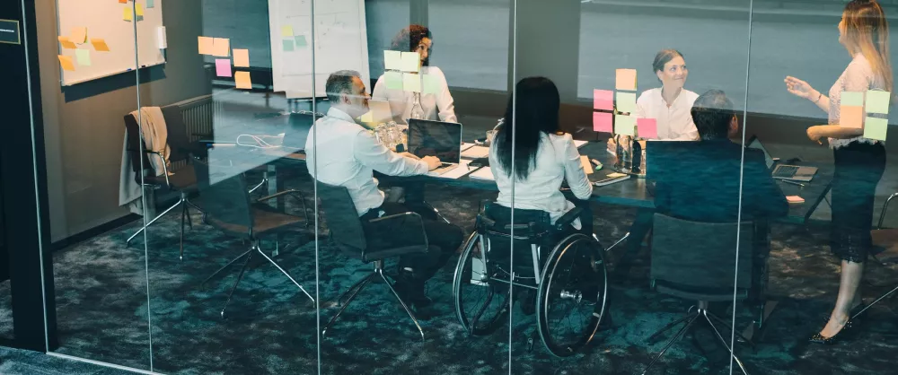 Group of special needs professionals working together in a conference room