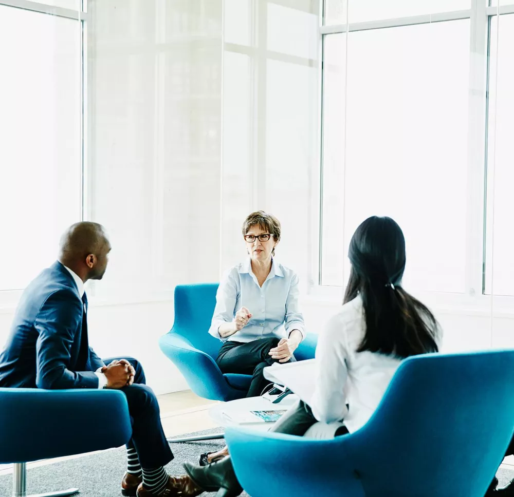 Group of financial professionals discussing philanthropy 