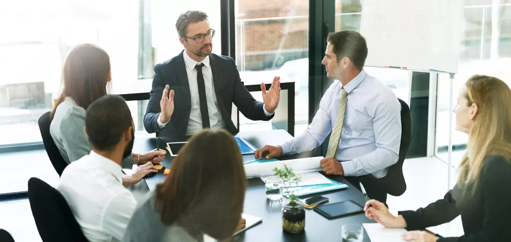 People around a table at a meeting