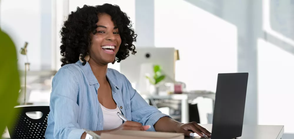 Woman sitting at a laptop