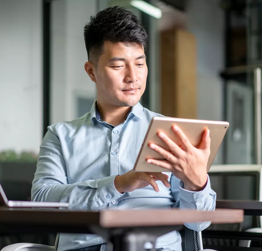 Man looking at a tablet 