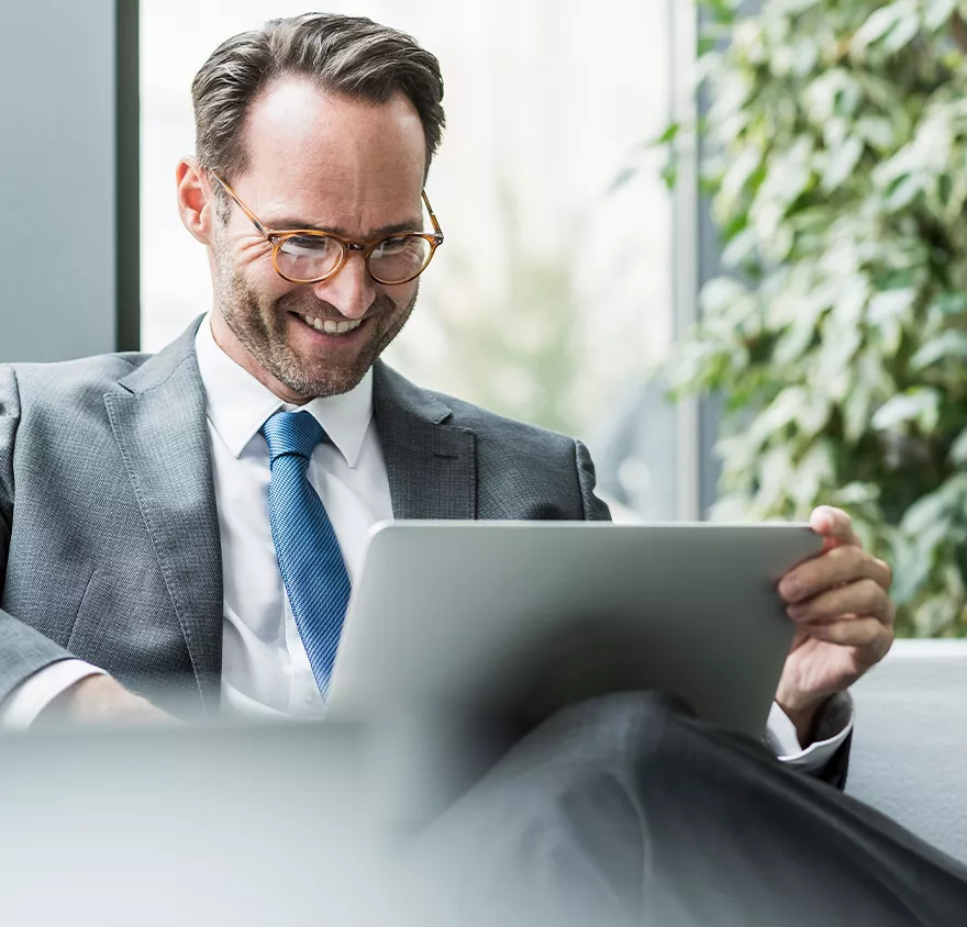 Image of a man looking at his laptop