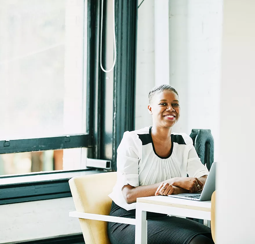 Woman sitting at a laptop