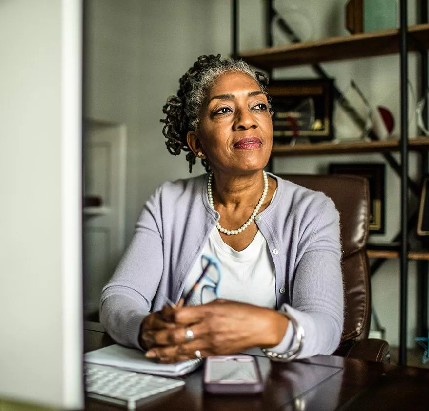 A woman sitting at a desktop