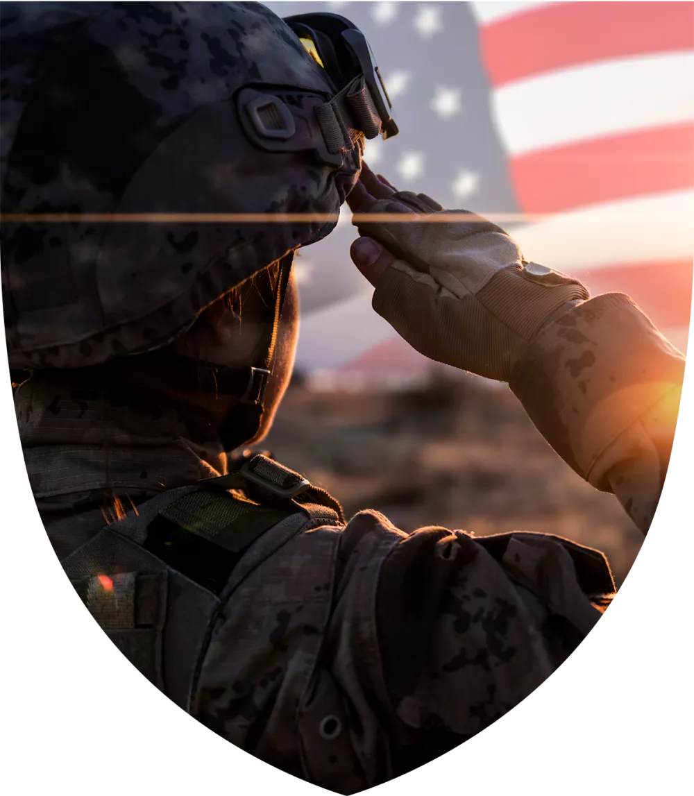 Soldier saluting with American flag in background