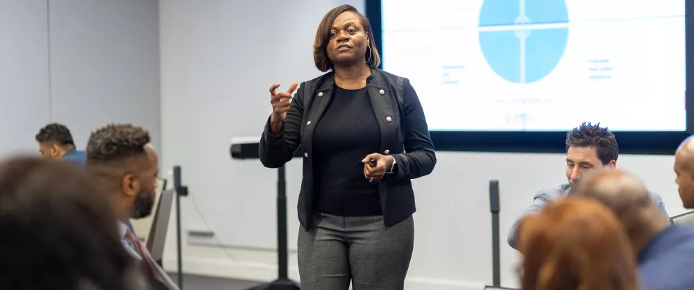 A woman speaking to a group of people