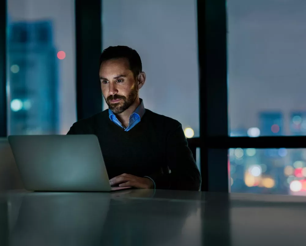 financial professional looking at partner promos on his laptop