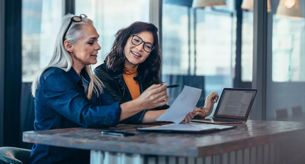 Two women discussing retirement planning