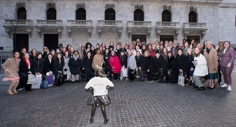 WWIW group standing in front of Fearless Girl statue