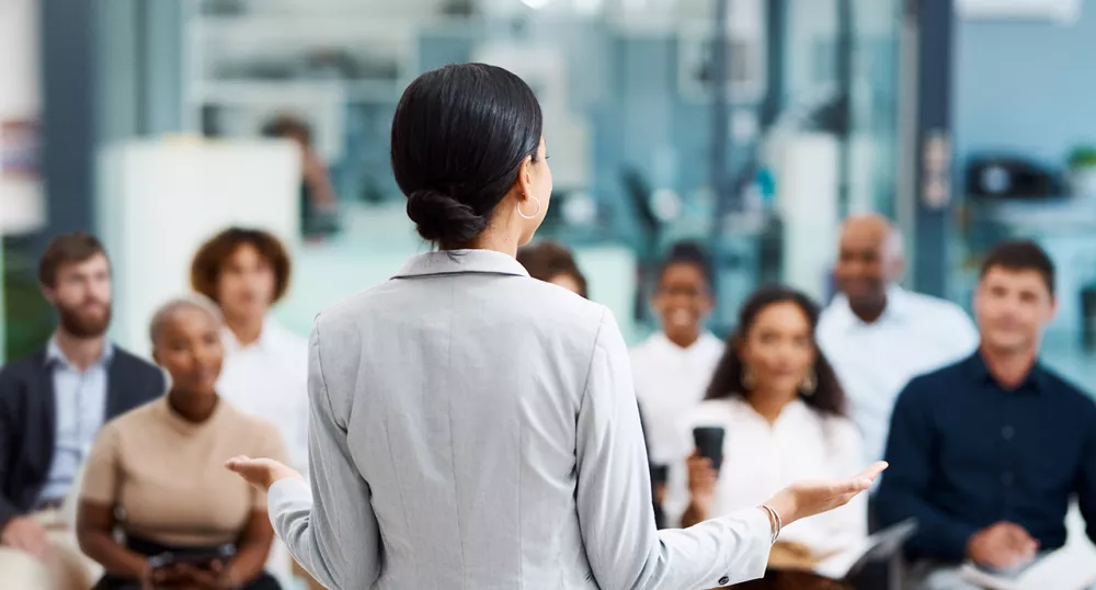 Women speaking to class