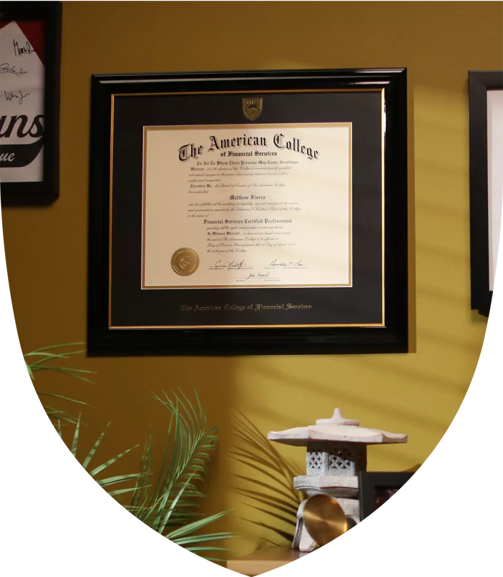 A certificate from the American College hanging on the wall