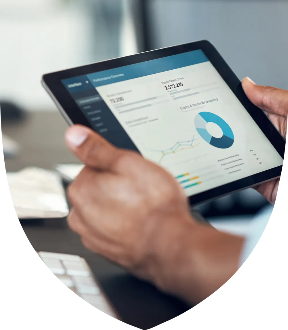 Person holding a tablet looking at stock portfolio