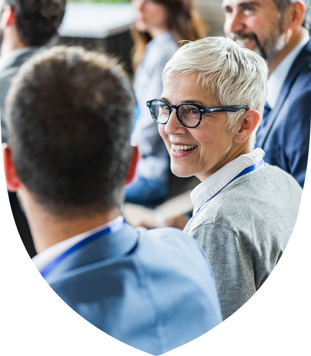 Older female advisor collaborating with a colleague 