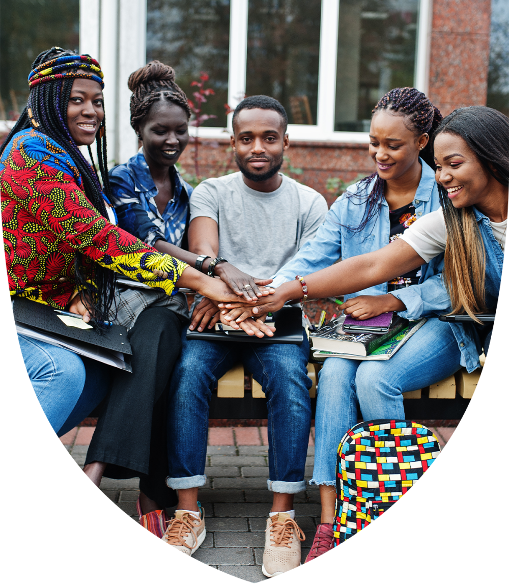 Group of black college students huddling together on campus