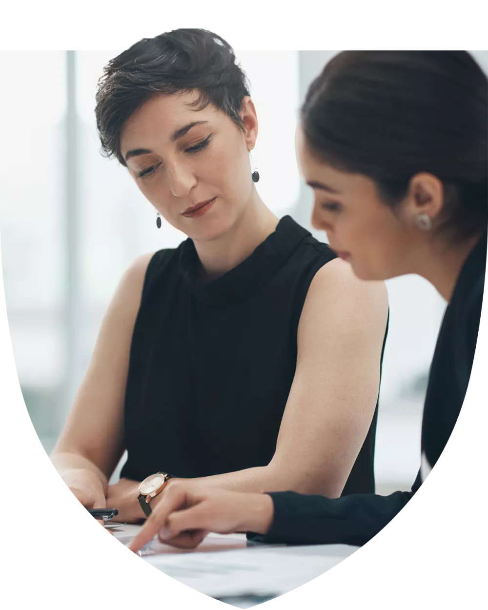 Two women studying for the tax planning certificate