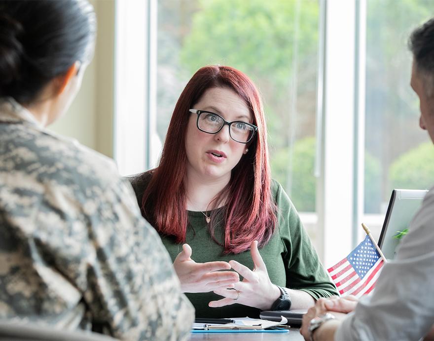 Financial advisor speaking with military members