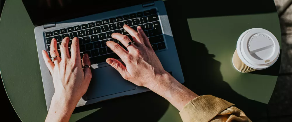 Woman signing up for a course on her laptop