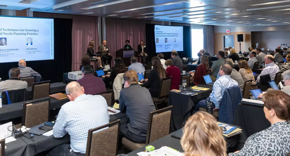 Attendees listening to a session at ASNP conference