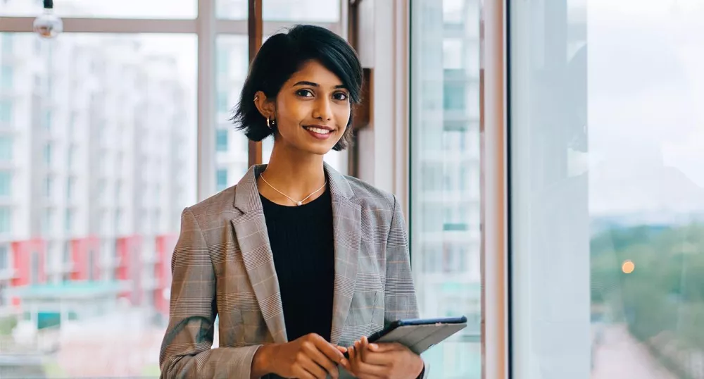 Financial professional female smiling in her office