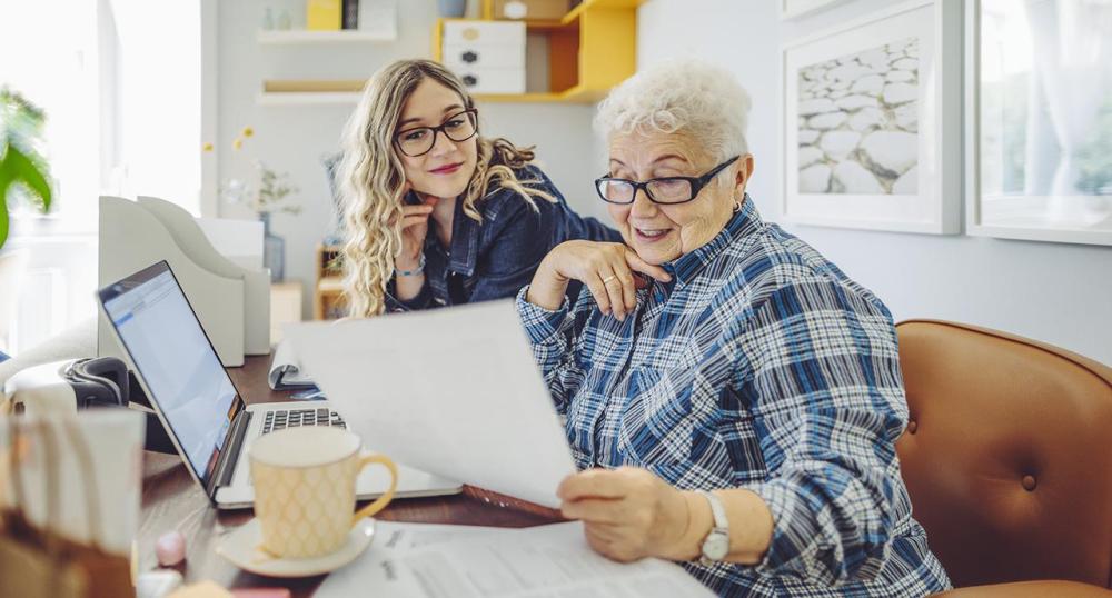 Financial planner working with client at home