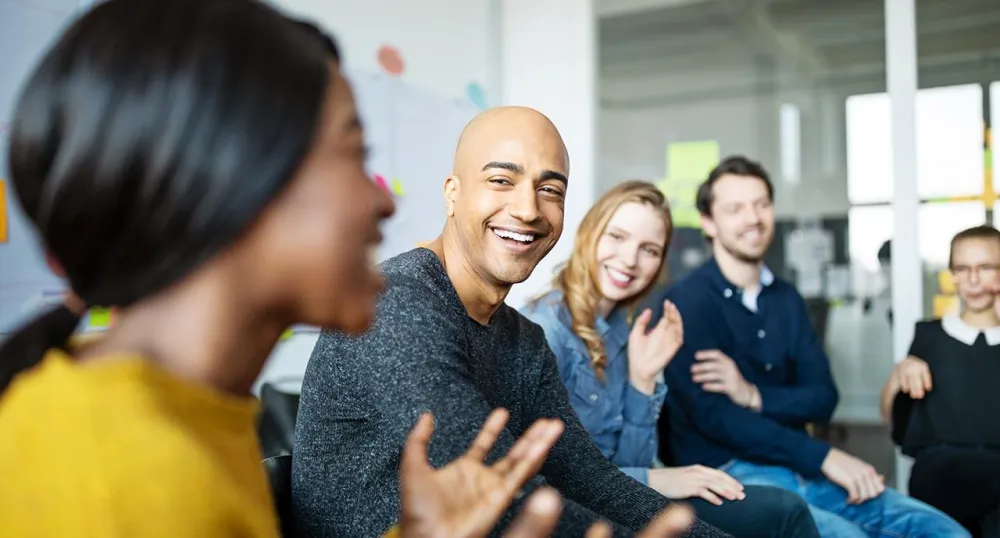 Work team meeting and laughing together