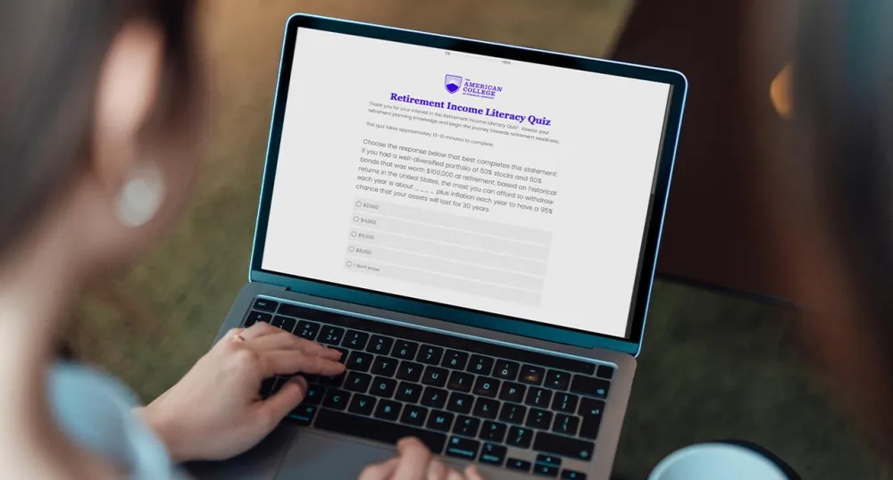 Woman looking at the Retirement Income Literacy Study on her laptop