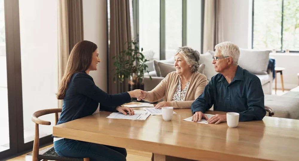 Two retirees meeting with financial advisor