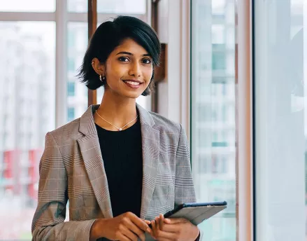 Financial professional female smiling in her office