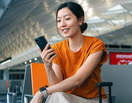 Woman tracking her retirement savings on her phone