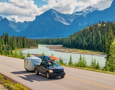 Truck driving through scenic road 