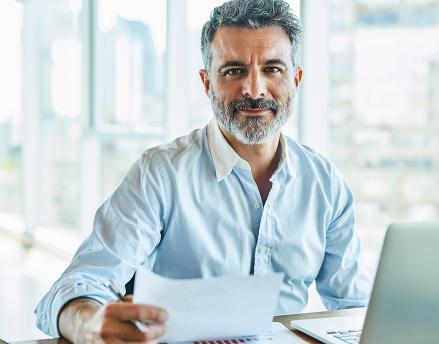 Middle aged man working at his desk